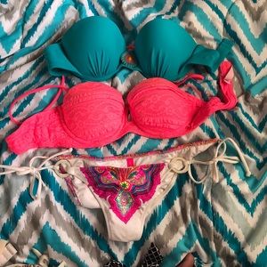 Two swimsuit tops and a swim bottom